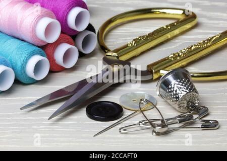 Scissors and sewing supplies thimble cotton pins Stock Photo