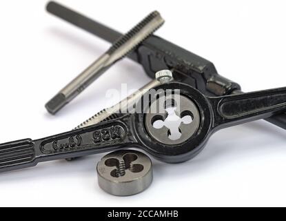Cutting iron and taps Stock Photo