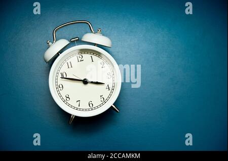 white alarm clock still life Stock Photo