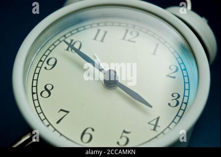 white alarm clock still life Stock Photo
