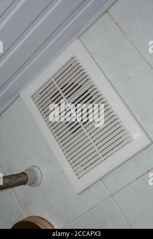 Cleaning ventilation in the bathroom from mold. Clean ventilation. Room cleaning service. Stock Photo