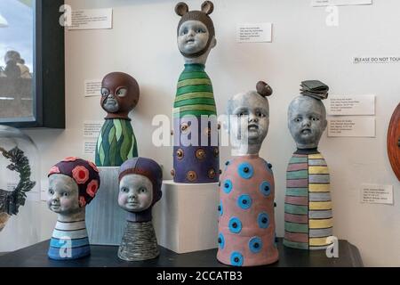 artwork at the 'Stranger Factory' in Nob Hill, Albuquerque, New Mexico    [ earthenware figures by Flora Art Studio ] Stock Photo