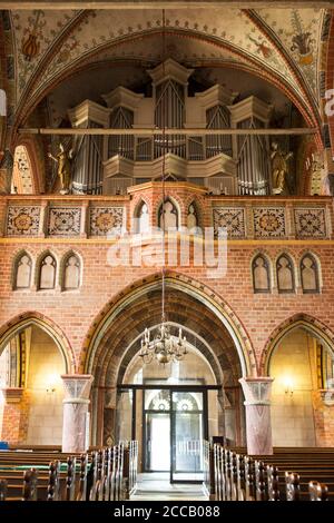 The pipe organ over the main entrance of the Marienkirche (St Mary's church) in Bergen auf Rügen, Germany. Stock Photo