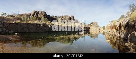 Pond lake situated in lush landscape at Boab Quarry Campsite in Western Australia. Stock Photo