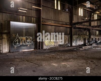 Interior of old abandoned factory warehouse. Stock Photo