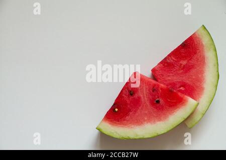 Two slices of ripe watermelon on white background, top view Stock Photo