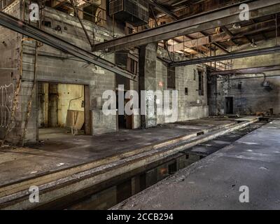 Interior of old abandoned factory warehouse. Stock Photo