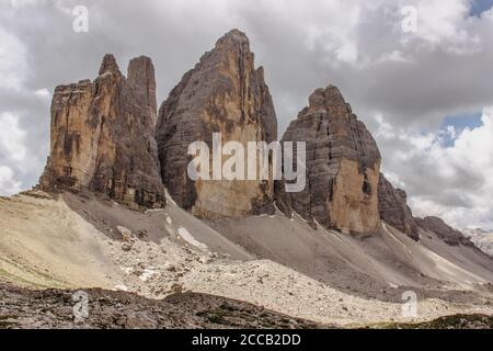 Hiking around three peaks of Tre Cime di Lavaredo (Drei Zinnen), Dolomites, Italy. One of the best-known mountain groups in the Alps. Active healthy l Stock Photo