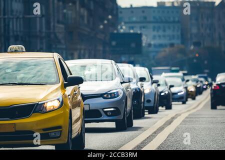 A lot of cars standing in a queue in city center at sunset Stock Photo ...