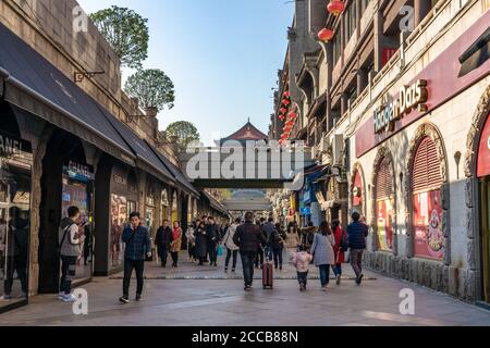 Shopping street with malls in the downtown area near the famous Bell Tower in Xian, China Stock Photo