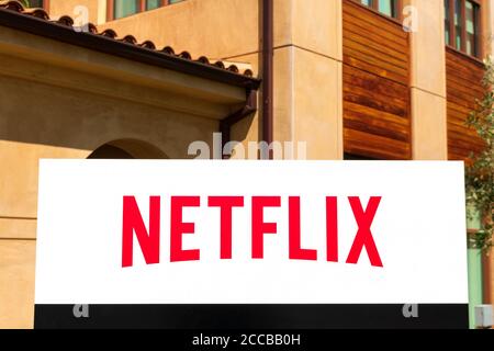 Netflix sign at company headquarters in Silicon Valley. Netflix, Inc. is an American media-services provider and production company - Los Gatos, Calif Stock Photo