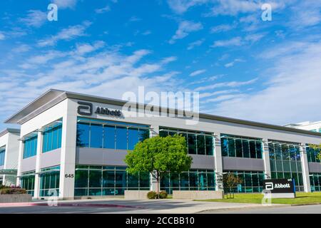 Abbott Laboratories modern office exterior under blue sky. Abbott Laboratories develops a broad line of health care products and services - Sunnyvale, Stock Photo