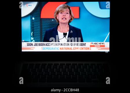 Washington, USA. 20th Aug, 2020. A photo illustration of a laptop computer screen shows Senator Tammy Baldwin (D-WI) speaking on the fourth night of the 2020 Democratic National Convention, which is being held almost entirely virtually, in Washington, DC, on August 20, 2020, amid the Coronavirus pandemic. Tonight, former Vice President Joe Biden officially accepted the Democratic nomination for President with 75 days to go before federal election day. (Graeme Sloan/Sipa USA) Credit: Sipa USA/Alamy Live News Stock Photo