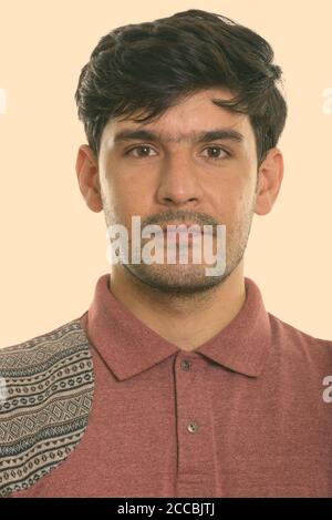 Studio shot of face of young Persian man Stock Photo