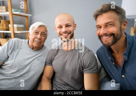 Three Generation Men Family Portraits Front View Stock Photo