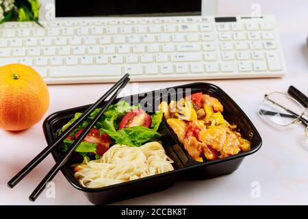 Healthy lunch ordering. Working from home concept. Asian cuisine. Stock Photo