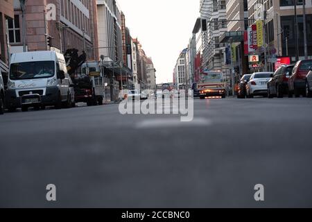 Berlin, Germany. 21st Aug, 2020. The Friedrichstraße is almost deserted. At shortly after six o'clock the access roads to Friedrichstraße between Leipziger Straße and Französische Straße were closed to traffic. The background to this is the planned pilot project 'car-free Friedrichstraße', which will start on August 29 and last several months. Credit: Paul Zinken/dpa/Alamy Live News Stock Photo