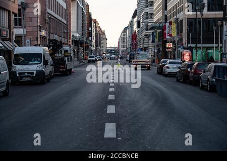 Berlin, Germany. 21st Aug, 2020. A man walks along Friedrichstrasse. At shortly after six o'clock the access roads to Friedrichstraße between Leipziger Straße and Französische Straße were closed to traffic. The background to this is the planned pilot project 'car-free Friedrichstraße', which will start on August 29 and last several months. Credit: Paul Zinken/dpa/Alamy Live News Stock Photo