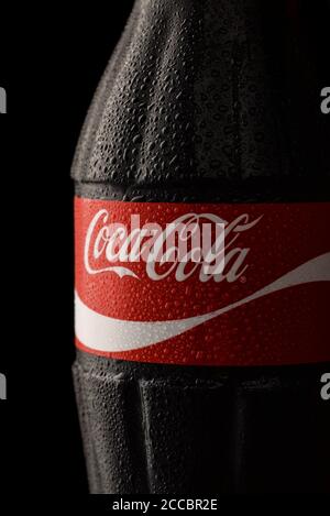 Samara, Russia - February 2017. Close up of Coca-Cola classic bottle with drops on black background Stock Photo