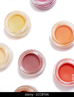 Paints in small transparent containers isolated on a white background Stock Photo