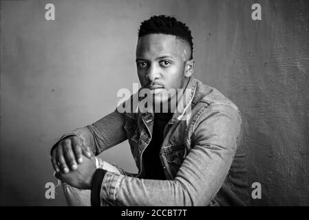 african stock photo of black gentlemen in smart clothes in studio setting Stock Photo