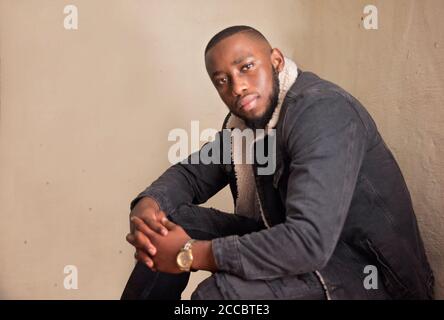 african stock photo of black gentlemen in smart clothes in studio setting Stock Photo