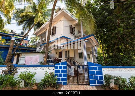 Candolim, North Goa, India - November 23, 2019: Street view of Candolim at sunny day with typical residential building or guest house in Candolim, Nor Stock Photo