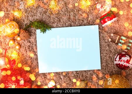 postcard ,christmas frame and toys with blue leaf, bokeh, flatley, copyspace Stock Photo