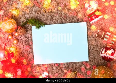 postcard ,christmas frame and toys with blue leaf, bokeh, flatley, copyspace Stock Photo