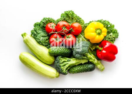 A tabletop arrangement of fresh vegetables multicolored, top view Stock Photo