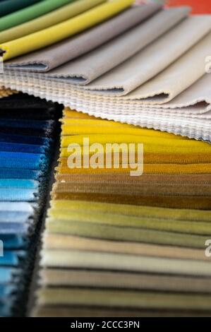 Multi colored velvet samples on fabric swatch creating a colorful soft background Stock Photo