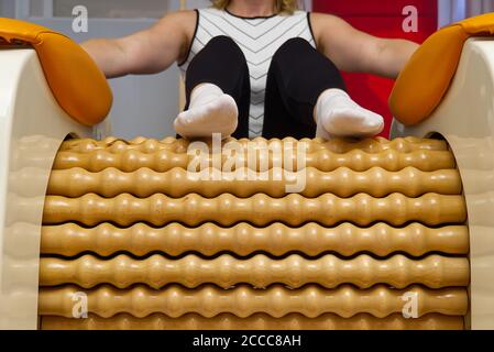 woman making massage for leg femur. Roll Massage machine is a way to shape  the figure. Skin Care, body care concept. modern relax massage equipment  Stock Photo - Alamy