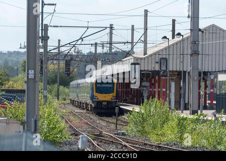 A  Northern Rail Class 195 diesel train at Warrington Bank Quay station on the West Coast Main Line. WCML Stock Photo