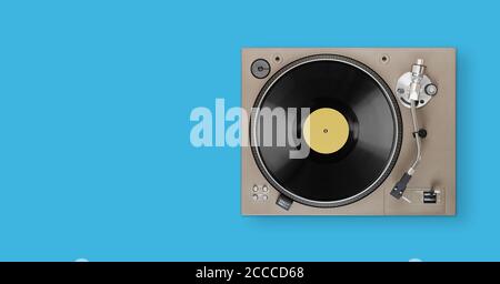 old turntable player with lp vinyl record on blue background top view. Clipping path. Stock Photo