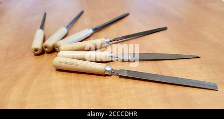 Close up shot of warding file assortment on a wooden table Stock Photo ...
