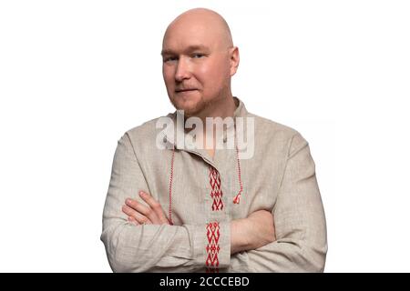 Bald man in national dress crossed his arms, isolated on white Stock Photo