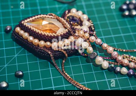 Beautiful multicolor jewelry lying on the table Stock Photo