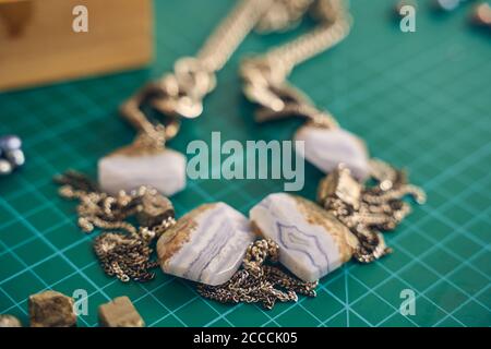 Jewelry with white stones on a green background Stock Photo