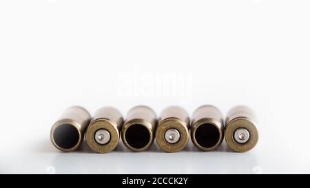 9 Shells Used 9 mm bullet casings on white background Stock Photo - Alamy
