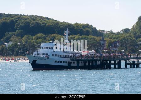 Binz, Germany. 17th Aug, 2020. The Cap Arkona has moored at the pier in Binz, where tourists are already waiting. The ship takes tourists several times a day to the chalk cliffs on the island of Rügen. Credit: Stephan Schulz/dpa-Zentralbild/ZB/dpa/Alamy Live News Stock Photo