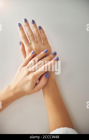 Woman demonstrating fingers with new pretty manicure Stock Photo