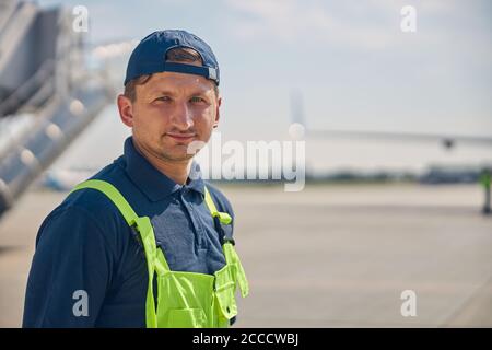 Serious aircraft mechanic posing for the camera Stock Photo