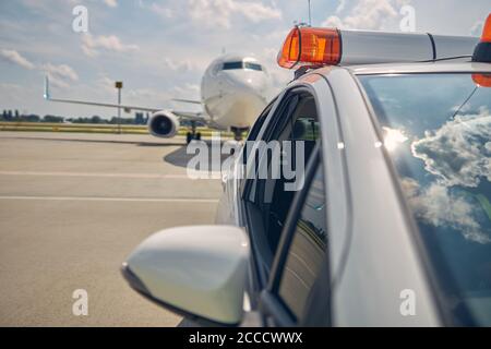 Airport vehicle with flashing lights showing the way Stock Photo