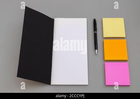 Business copy space with luxury notebook, pen and multicolored sticky notes Stock Photo