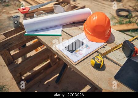 Builder safety helmet and constructor worker tools Stock Photo