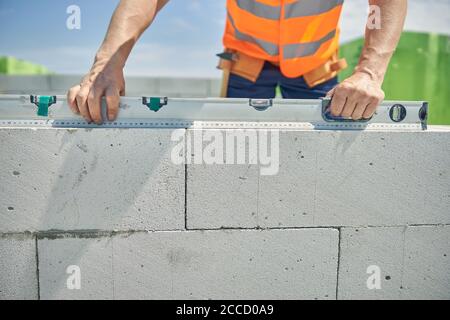 Skilled male worker using a spirit level Stock Photo
