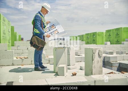 Focused engineer working at a construction site Stock Photo