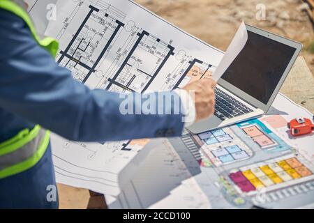 Male constructor working on a technical drawing Stock Photo