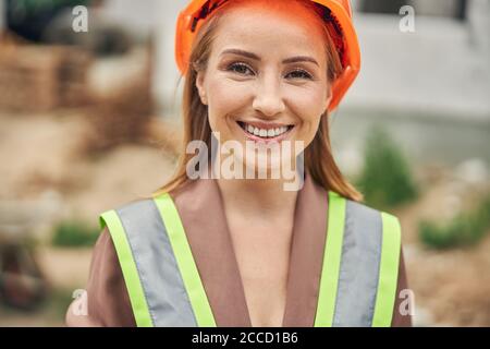 Merry lady in a helmet posing for the camera Stock Photo
