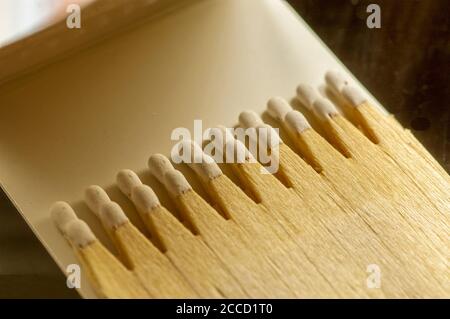 macro shoot of advertising wooden matches with a head of white phosphorus in the matchbook. natural light Stock Photo